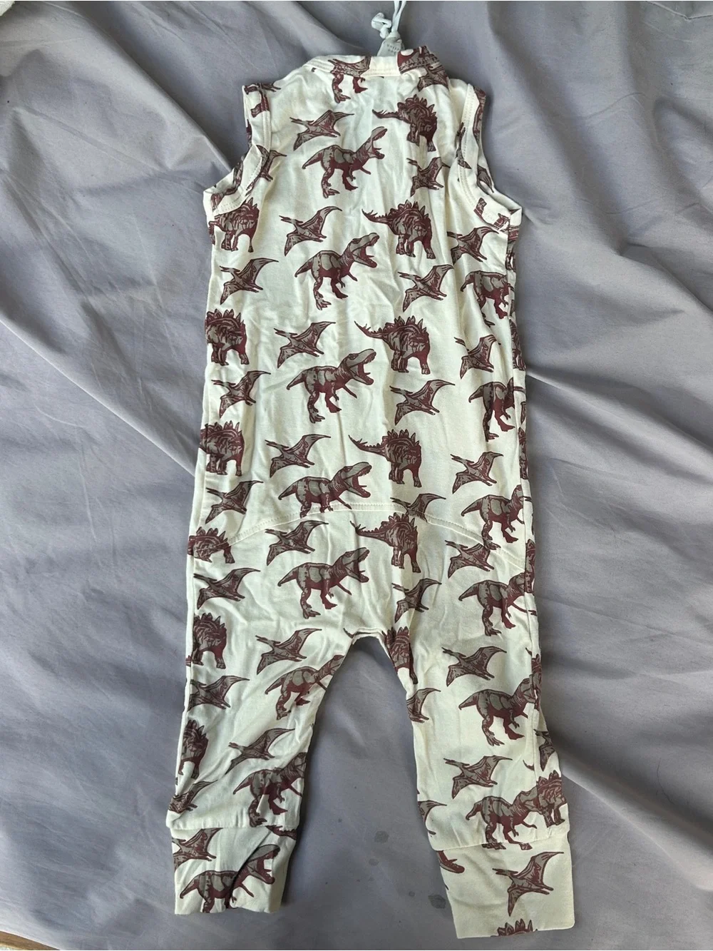 Kate Quinn cream sleeveless dinosaur romper